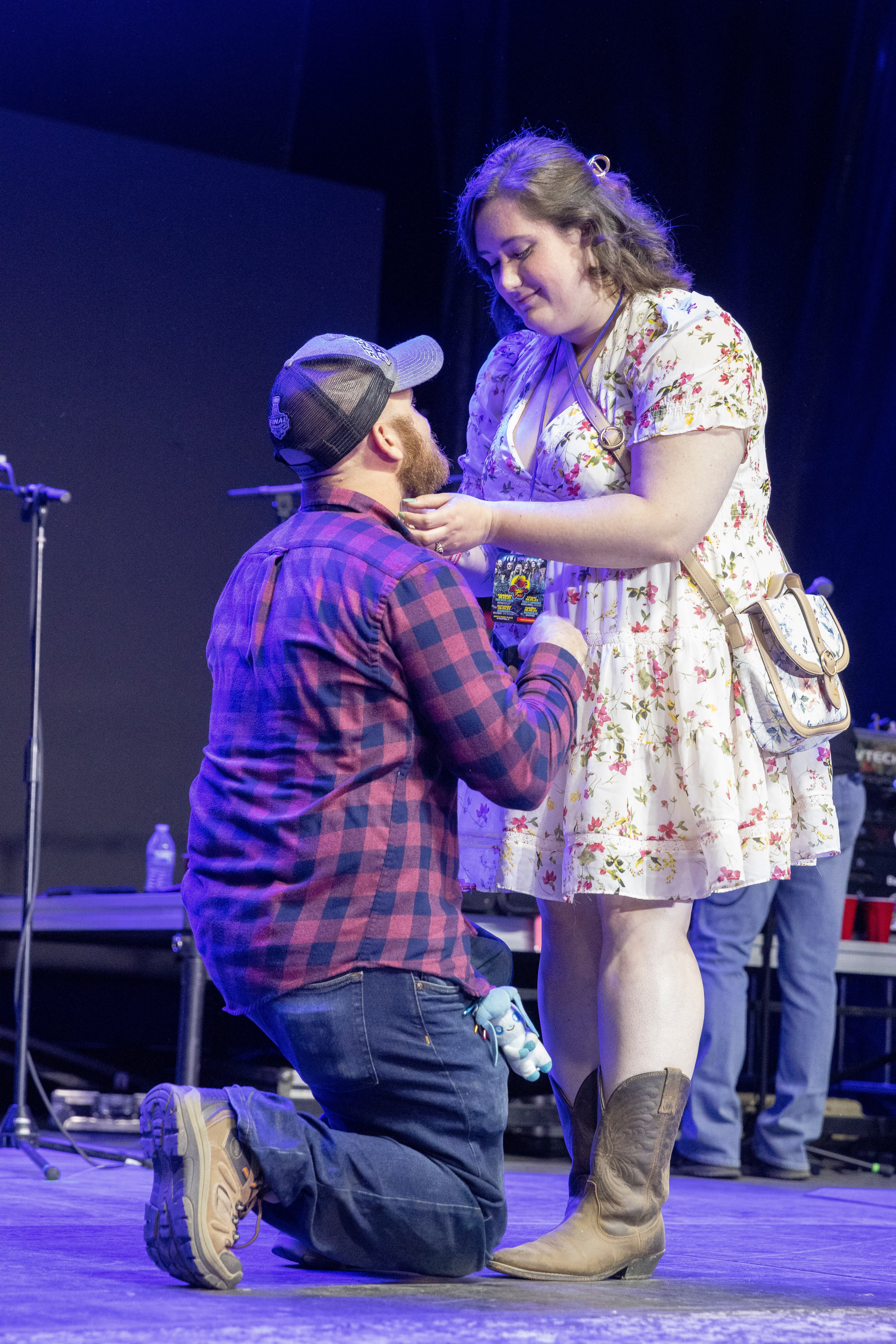 Blake Gabehart gives a surprise onstage proposal to Tessa Nelson on Friday, Aug. 4, 2023, at Streator Fest prior to Tracy Lawrence performing.