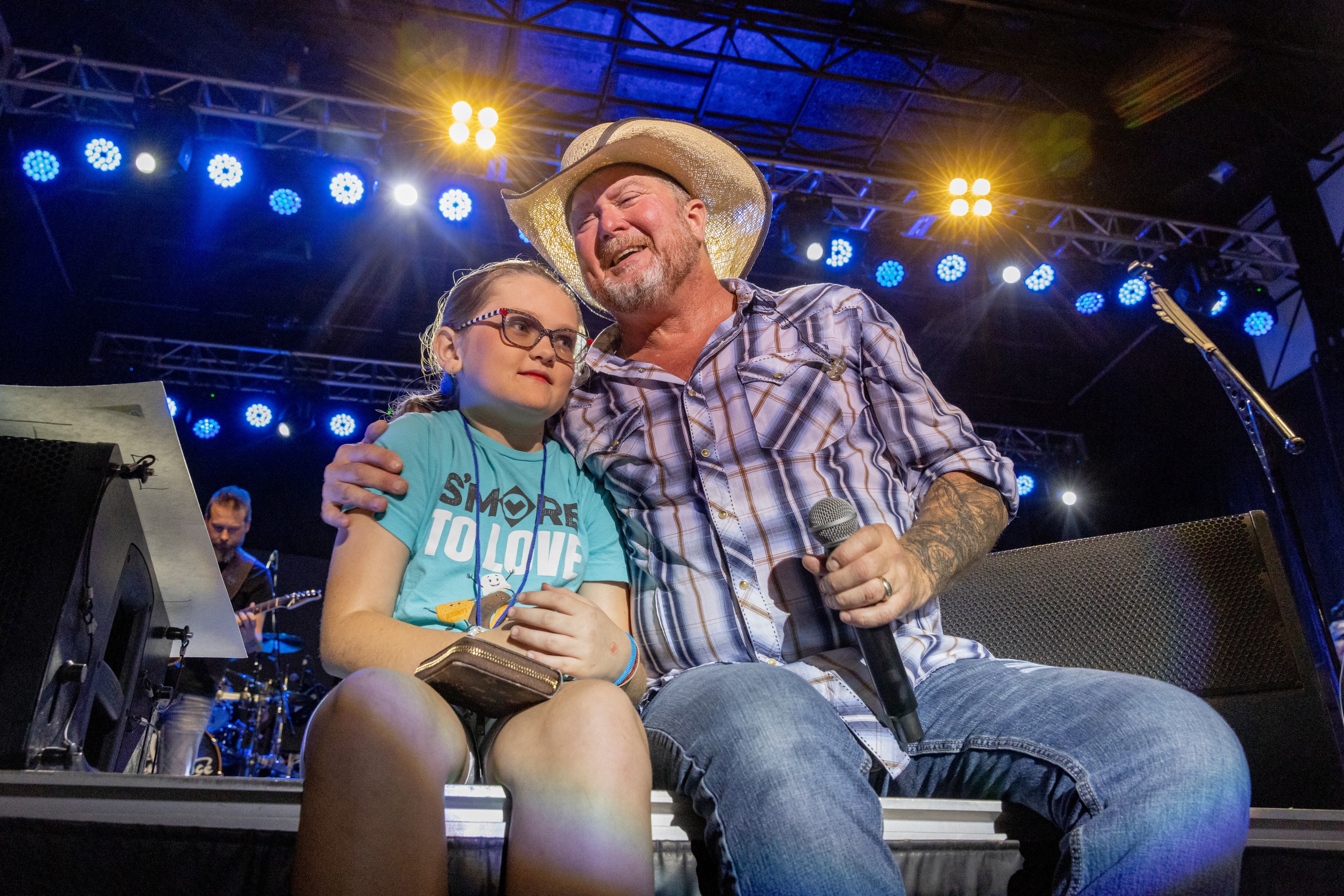Brooklynn Graham joins Tracy Lawrence on stage Friday, Aug. 4, 2023, for a performance of the song "Texas Tornado" during Streator Fest at Northpoint Plaza.